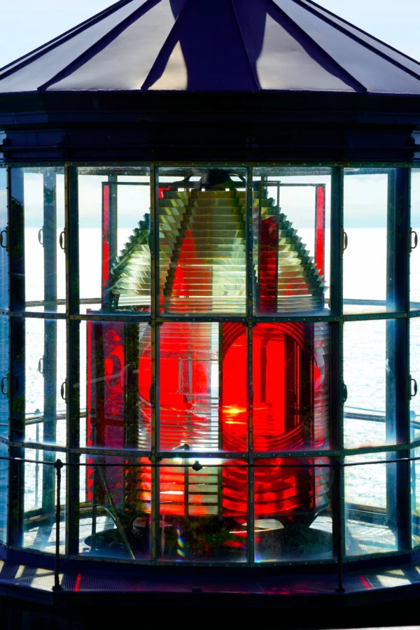 An up close view of the geometrically-cut red and clear lens in Cape Meares Lighthouse on the Oregon Coast.