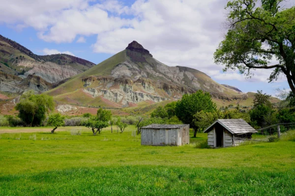 Sheep Rock stands tall behind Cant Ranch in John Day Fossil Beds National Monument in Oregon.