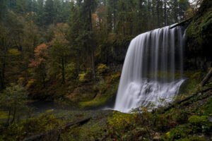 Middle North Falls drops gracefully off a ledge in Silver Falls State Park on a perfect autumn evening.