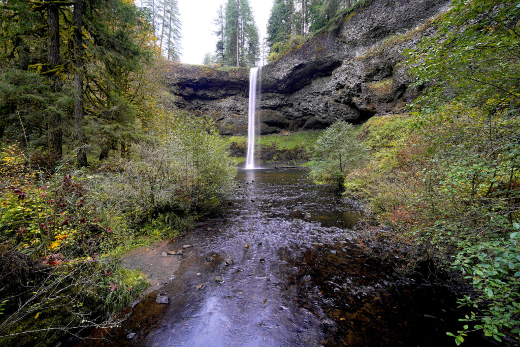 Looking upstream at majestic South Falls from the bridge below it on an autumn afternoon in Silver Falls State Park.