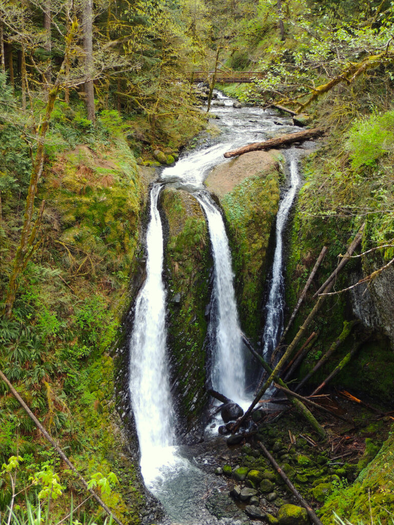 Oneonta Creek splits into three channels right before dropping over a 60-foot cliff, creating Triple Falls as seen in spring 2016.