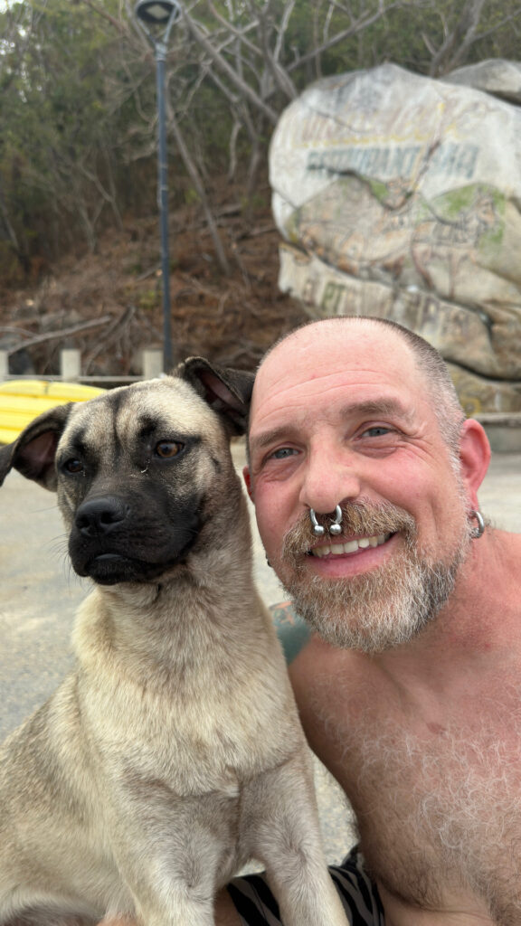 A man and a dog in Quimixto Mexico.