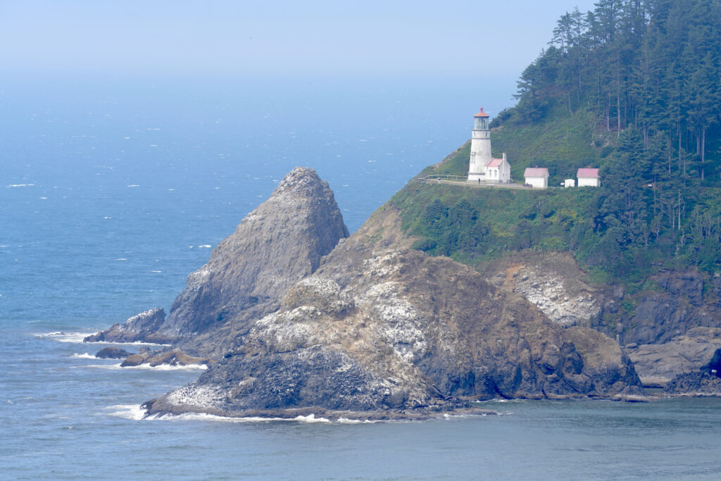 Heceta Head Lighthouse stands above the rocky Central Oregon Coast.