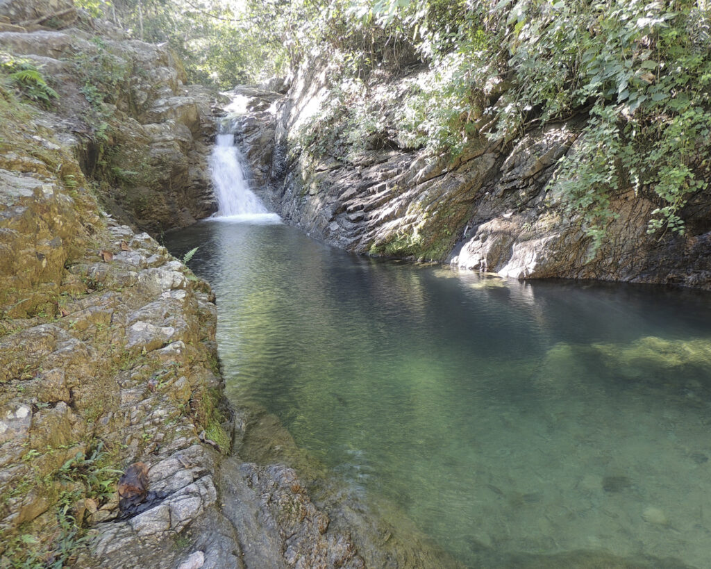 A waterfall with a pretty swimming hole at La Arenita outside of Puerto Vallarta Mexico.