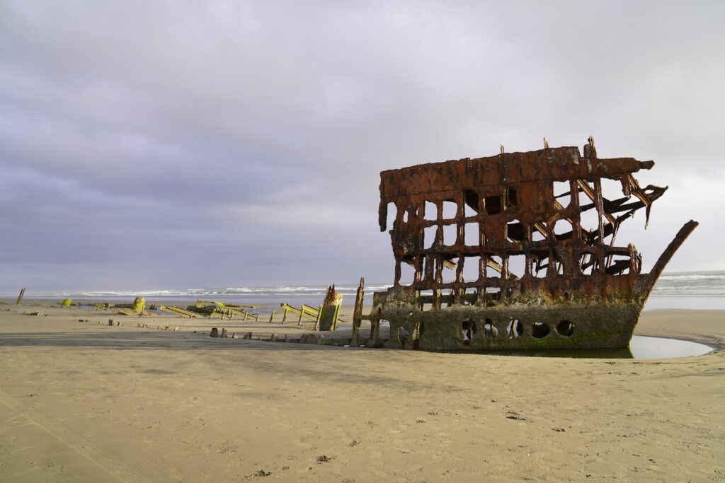 The rusting bow of the ship is all that's left of the Peter Iredale, which ran aground at Oregon's Fort Stevens Beach in 1905.