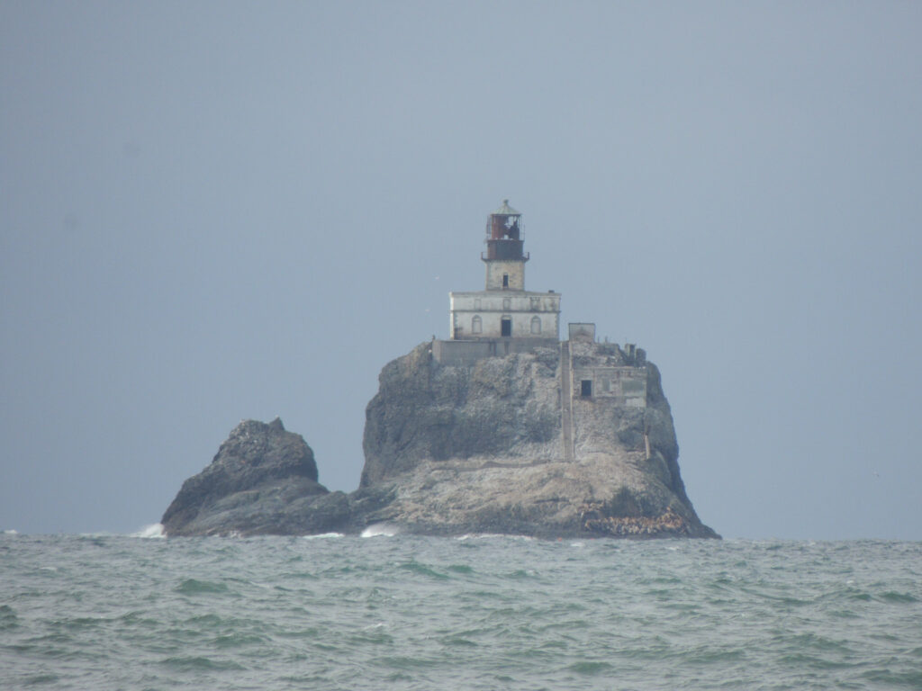 Tillamook Lighthouse, also known as Terrible Tilly, stands on a huge rock about a mile offshore from Ecola Point on the northern Oregon Coast.