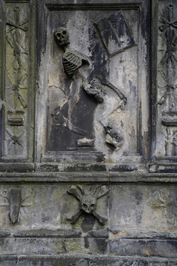 This macabre 1676 gravestone with a skeleton and a coffin with crossed scissors belongs to an anatomy professor in Edinburgh.