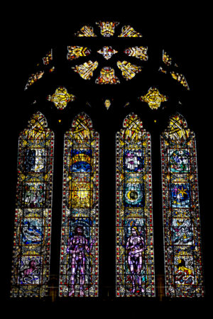 A relatively new stained glass window in Glasgow Cathedral shows Adam and Eve beneath the sun and moon.