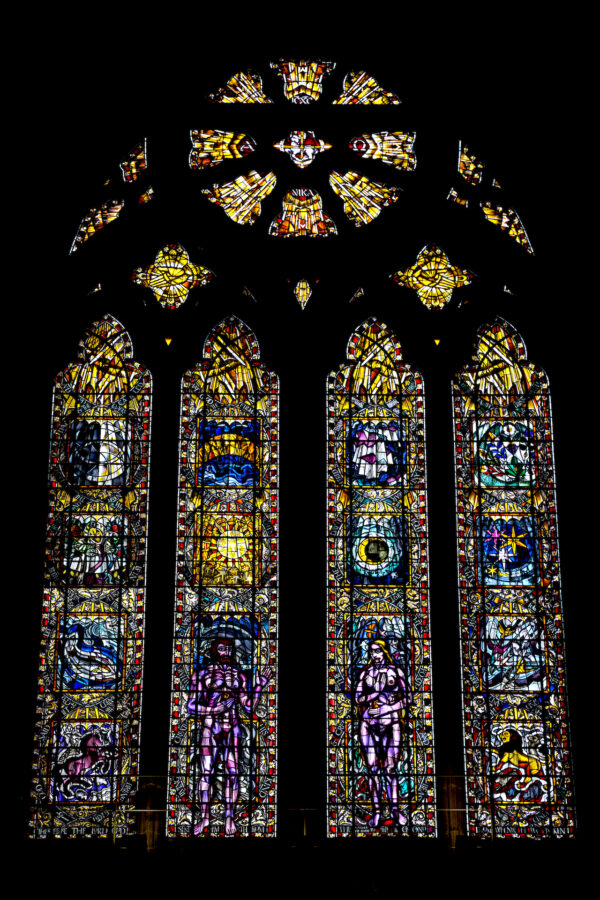 A relatively new stained glass window in Glasgow Cathedral shows Adam and Eve beneath the sun and moon.