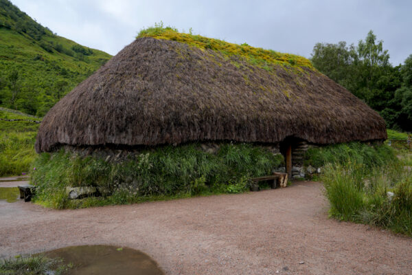 A recreation of a 1600's turf and kreel house stands in Glen Coe, Scotland.