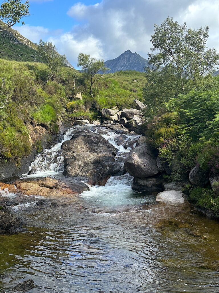 A small cascade tumbles over rocks in Glen Rosa on Isle of Arran, Scotland.