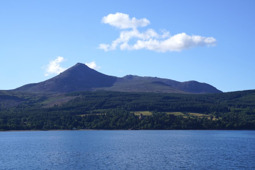 Looking across a bay at the highlands of Isle of Arran in Scotland.