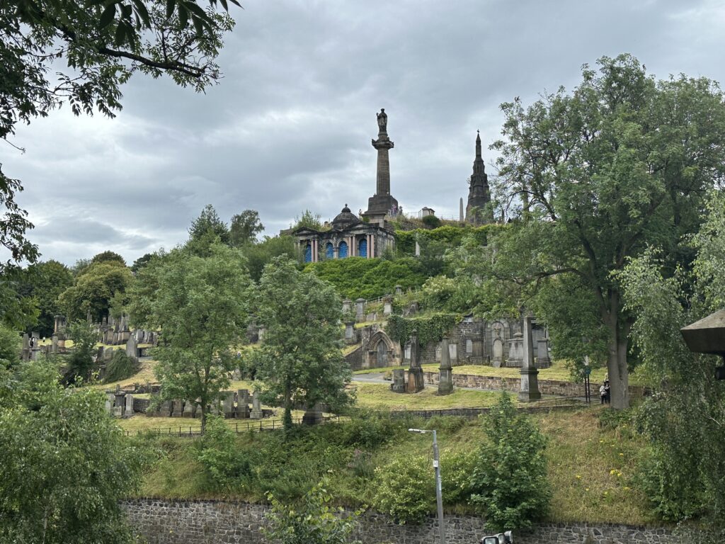 Looking up at the hillside Victorian-era cemetery known as Glasgow Necropolis.