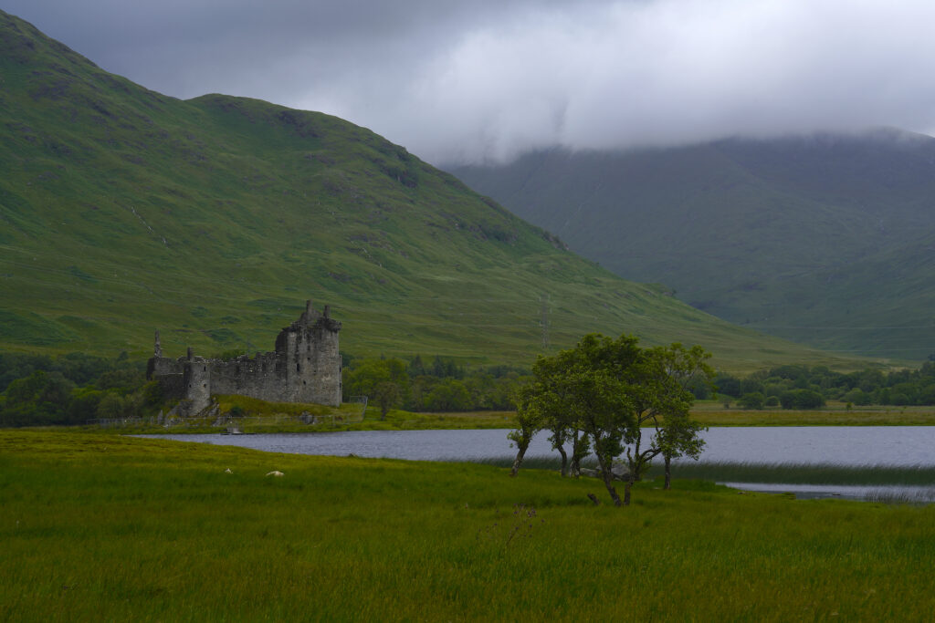 The ruins of Kilchurn Castle sit on a rock outcropping next to Loch Awe in Scotland's West Highlands.