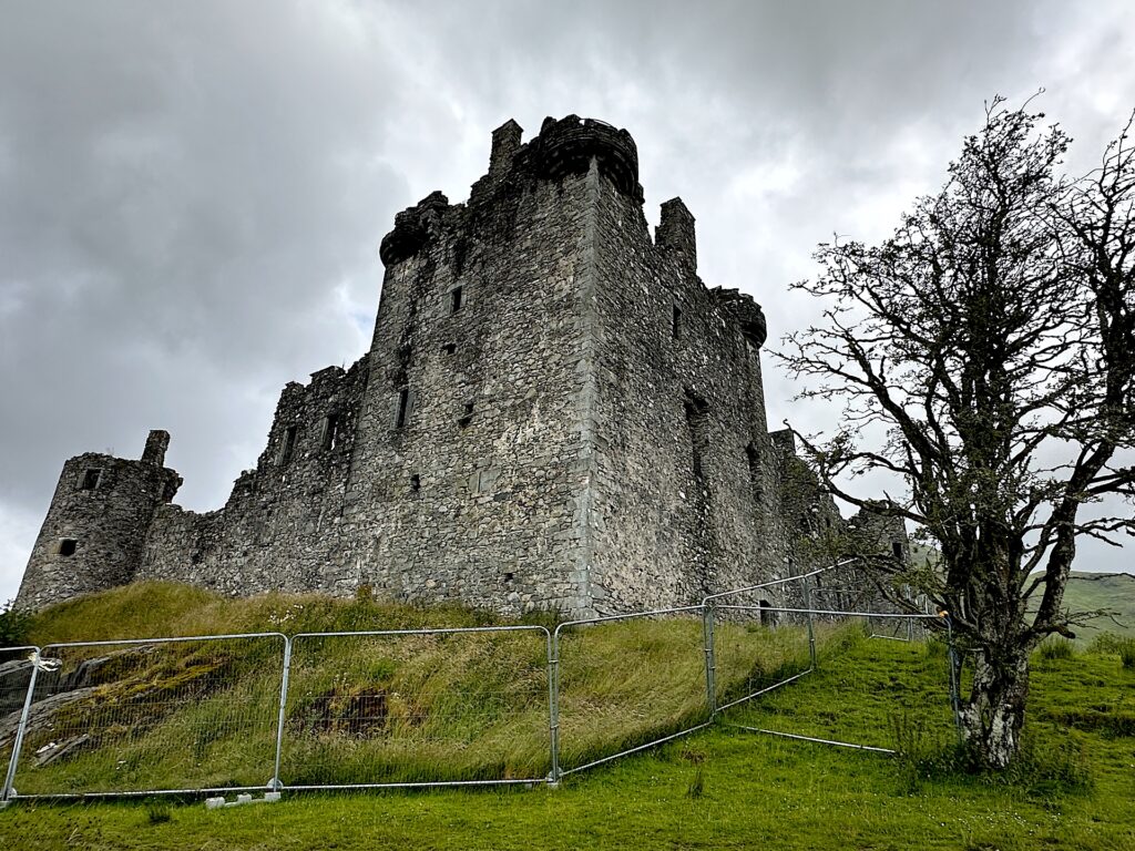 The fenced-off ruin of Kilchurn Castle in Scotland's West Highlands.