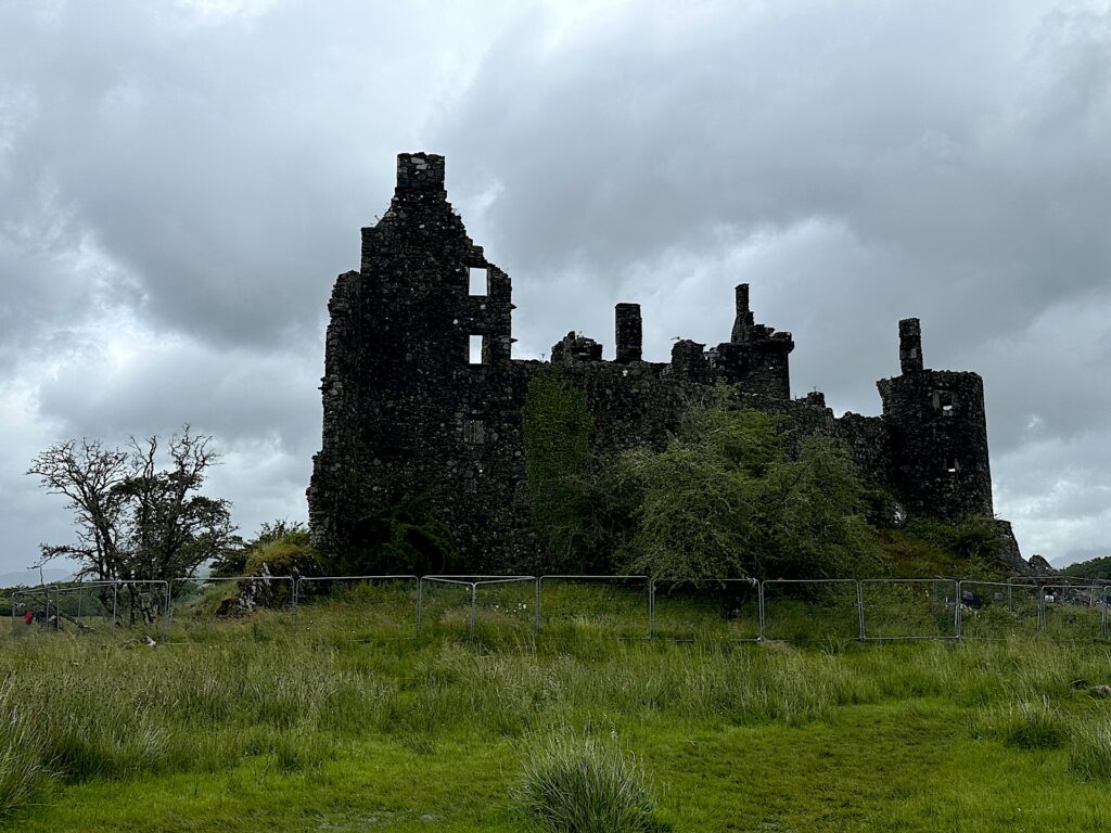 The ruins of dark and moody Kilchurn Castle in Scotland.