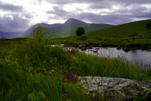 An idyllic scene unfolds at Loch Ba on Rannoch Moor in the Scottish Highlands.