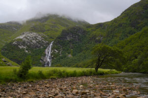 Lookiing up Upper Glen Nevis with Steall Waterfall crashing down the distant slopes.