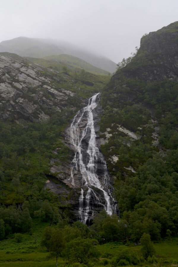 Mist descends on the highland peaks above Steall Waterfall in Scotland's Glen Nevis.