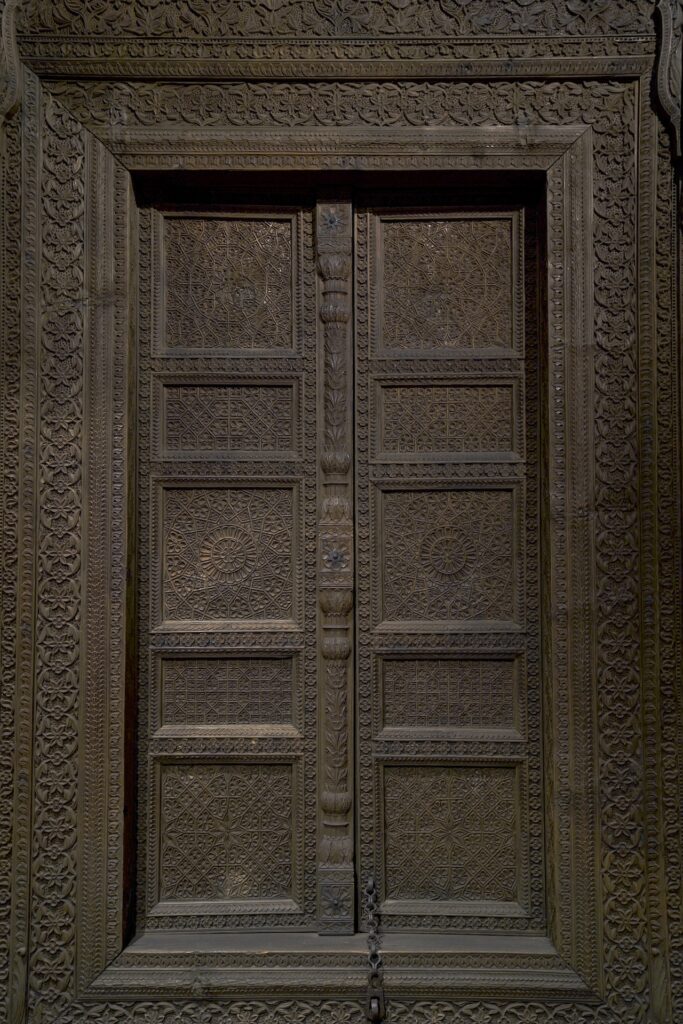 A hand-carved wooden door from India is displayed in Glasgow's Kelvingrove Art Gallery and Museum.