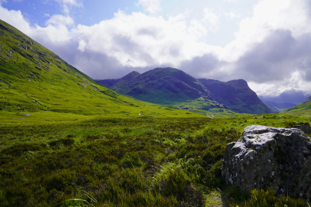 Looking down Glen Coe, Scotland toward the Three Sisters mountains.