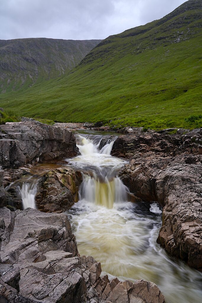 Glen Etive Waterfall in Scotland falls in two short steps.