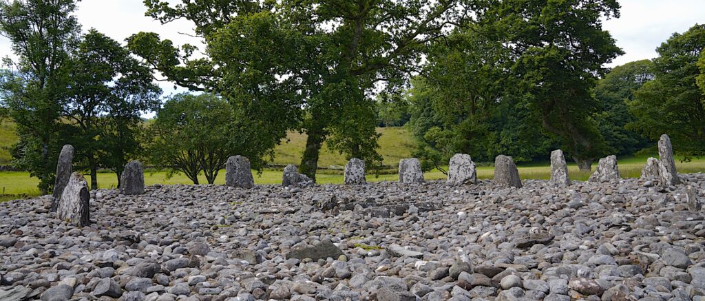 A semicircle of standing stones forms Temple Wood Stone Circle in Kilmartin Glen, Scotland.