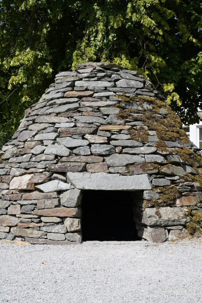 A recreation of a stone honeycomb cairn outside Kilmartin Museum in Scotland.