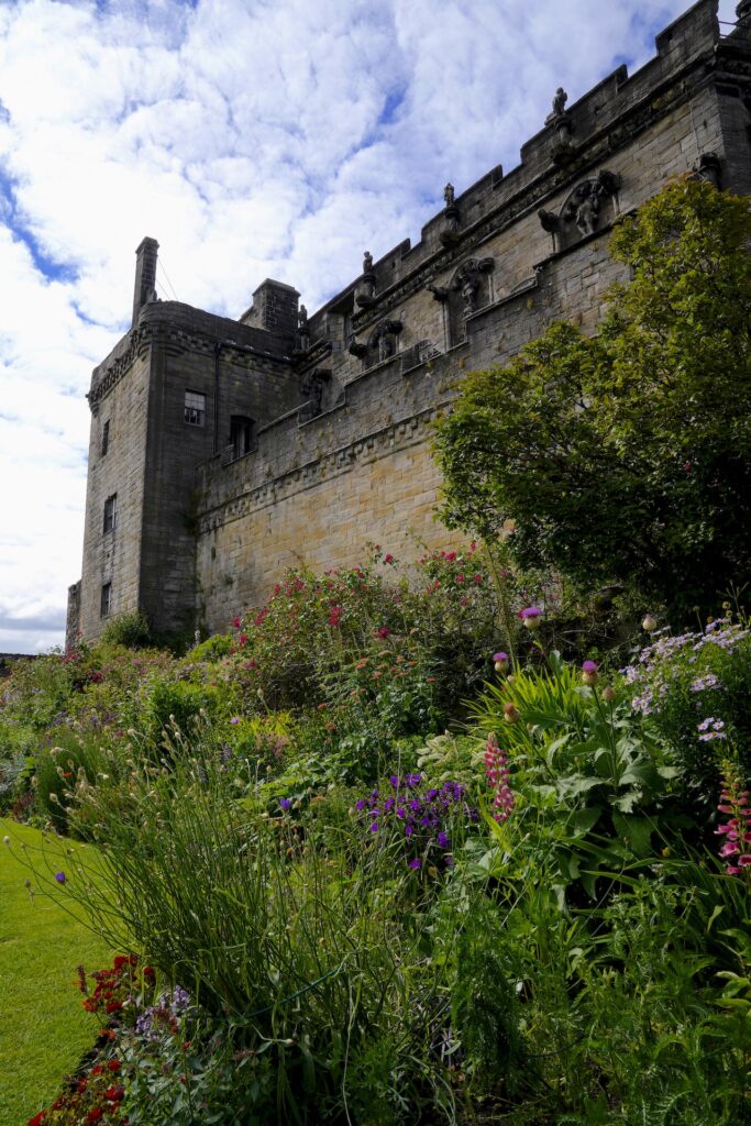 A pretty flower garden grows below the Royal Palace at Stirling Castle, Scotland.