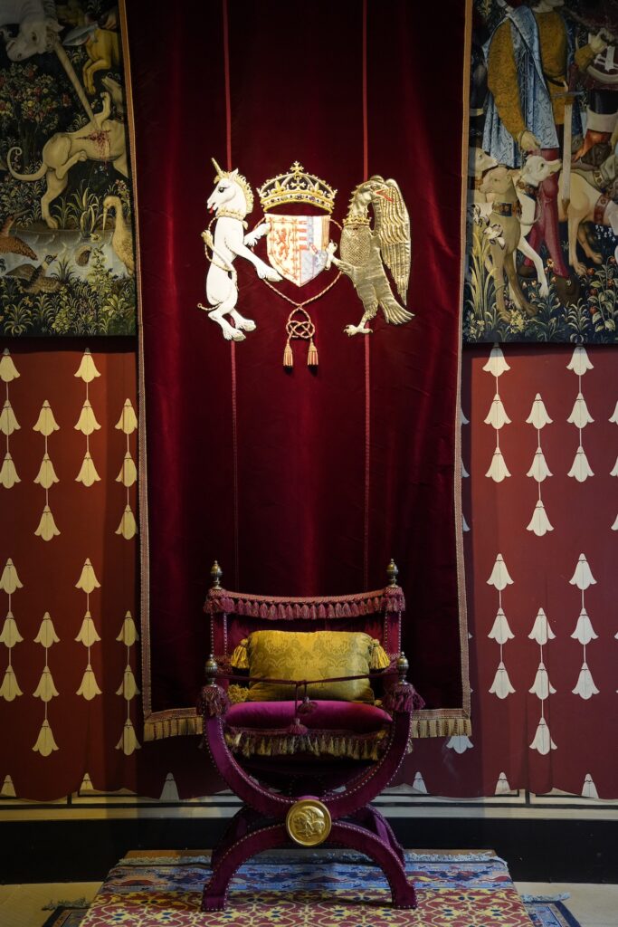 A red velvet banner hangs behind the Queen's Chair in her throne room in Stirling Castle, Scotland.