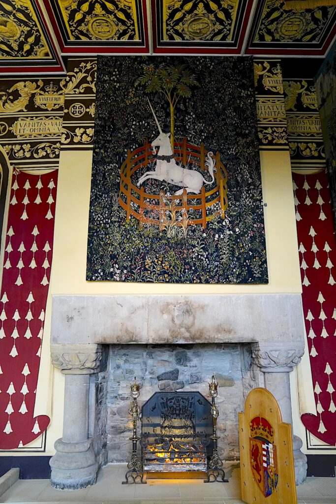 The famous unicorn tapestry hangs above a fireplace in the Queen's throne room in Stirling Castle, Scotland.